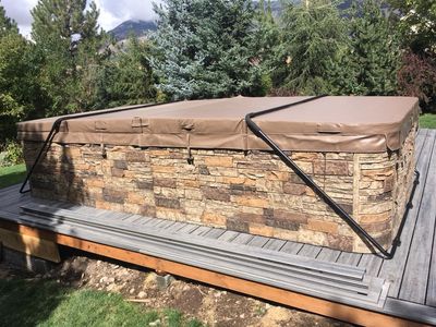 Hot tub with stone surround on deck
