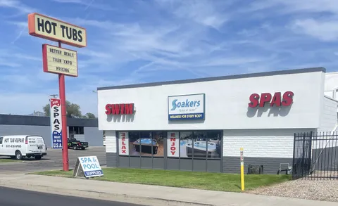 Soakers storefront in Midvale, Utah with the Wasatch mountains behind the shop